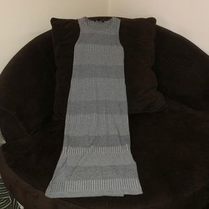 Grey skintight dress, goes a bit past the knees.